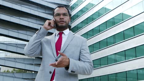 Professional-businessman-talking-by-smartphone